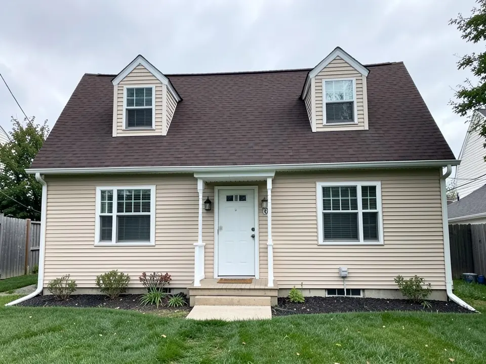 AI-drawn generic stand-in of a Cape Cod style house with beige horizontal vinyl siding, white window trim, two dormers, a white front door under a small porch roof and a dark brown shingle roof