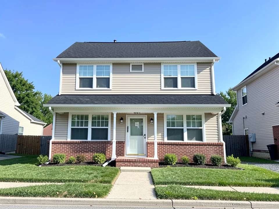 AI-drawn generic stand-in of a two-story house with white vinyl windows, white trim, light beige siding, red brick on the lower front, a covered porch and a black roof