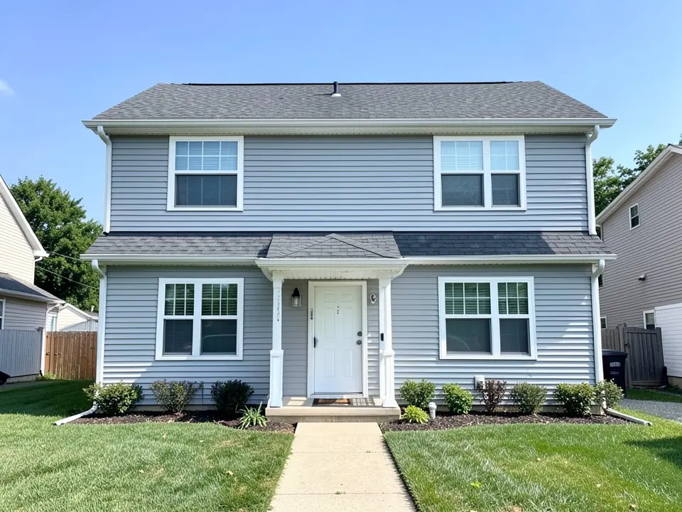 AI-drawn generic stand-in of a two-story house with pale blue-gray horizontal vinyl siding, white trim, a white front door under a small porch roof and a dark gray shingle roof
