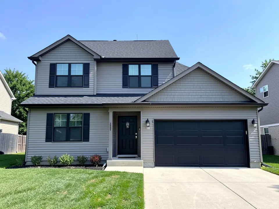 AI-drawn generic stand-in of a two-story house with medium gray lap siding, black shutters and front door, a black two-car garage door and a dark charcoal roof
