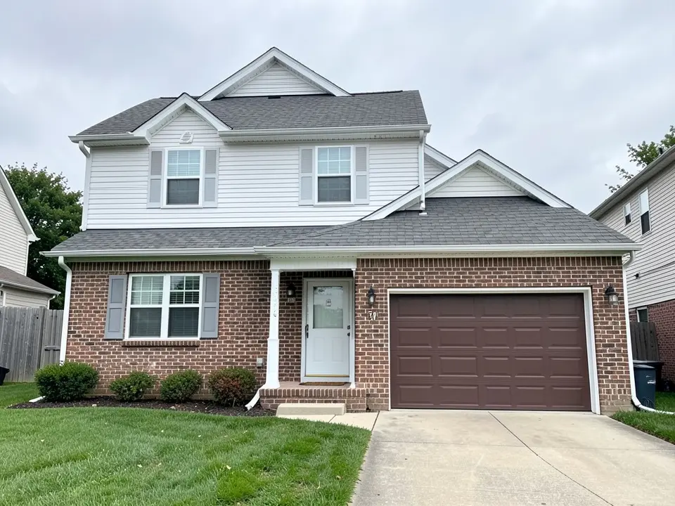 AI-drawn generic stand-in of a two-story house with red-brown brick on the ground floor, white siding on the upper floor, gray shutters, white trim, a white front door, a brown garage door and a gray shingle roof