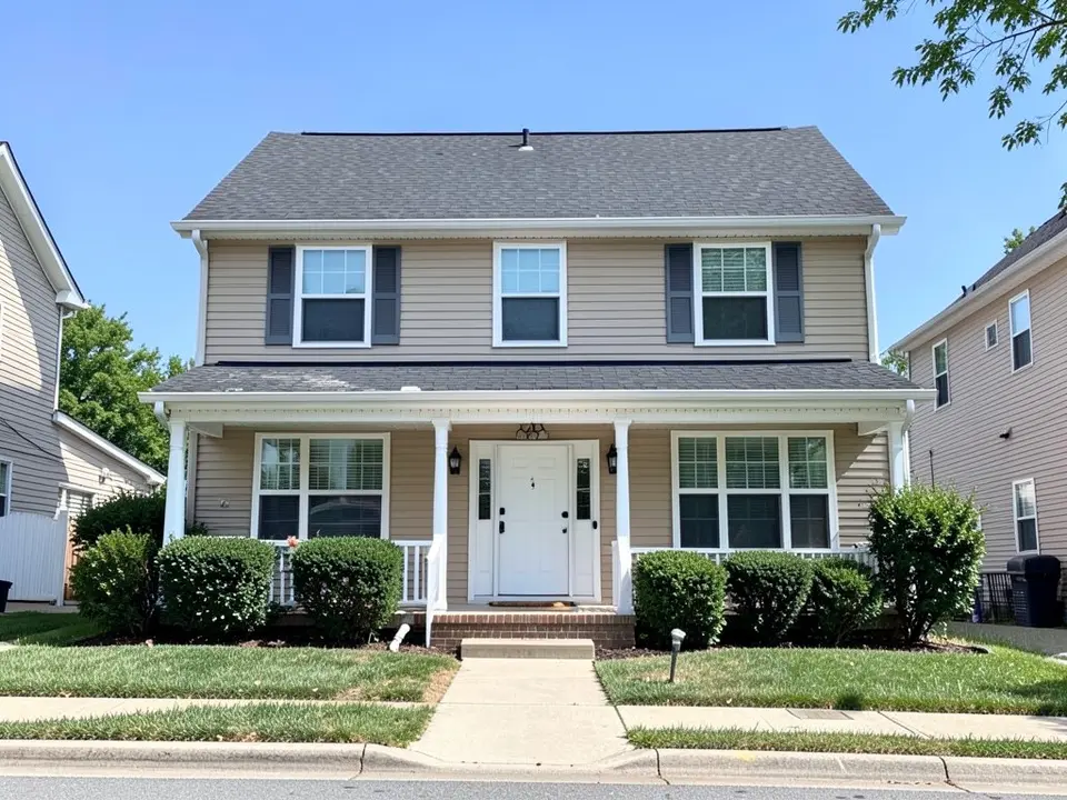 AI-drawn generic stand-in of a two-story colonial-style house with beige siding, dark gray shutters, white trim, a white front porch, a white front door and a dark gray shingle roof